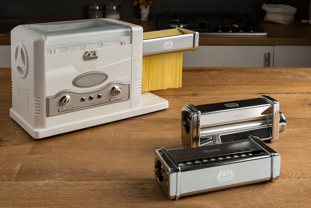 Home chef using Marcato electric pasta maker for homemade pasta