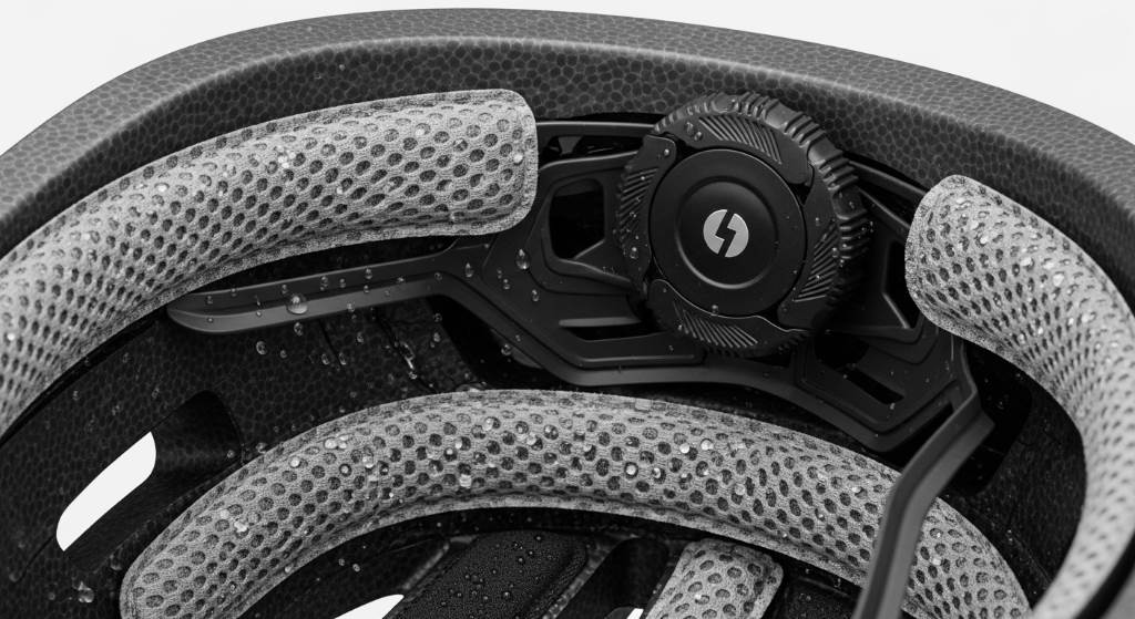 Close-up view of bike helmet interior showing moisture-wicking padding and adjustable fit system