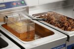 Commercial deep fryer with built-in oil filtration system showing clean filtered oil and removed food particles for extended oil life