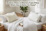 A split view of a white bamboo pillow and a memory foam pillow on a bed.